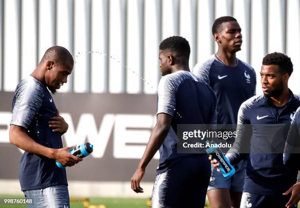 France's national football team players Djibril Sidibe and Lemar are seen during training session ahead of the World Cup 2018 final match against...