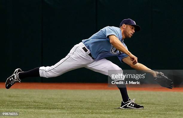 Outfielder Gabe Kapler of the Tampa Bay Rays catches a line drive against the Seattle Mariners during the game at Tropicana Field on May 16, 2010 in...