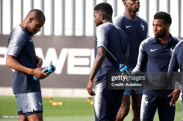 France's national football team players Djibril Sidibe and Lemar are seen during training session ahead of the World Cup 2018 final match against...