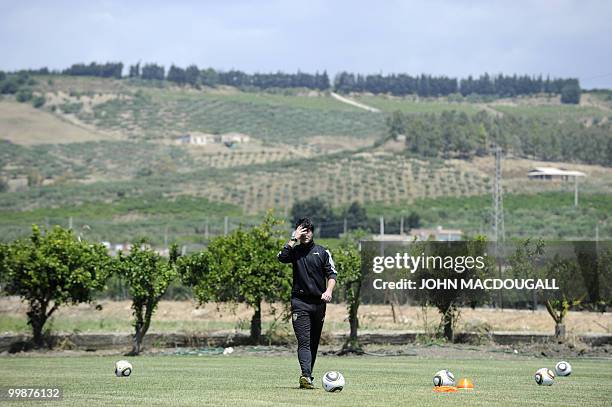 Germany's head coach Joachim Loew takes part in a training session at the Verdura Golf and Spa resort, near Sciacca on May 16, 2010. The German team...
