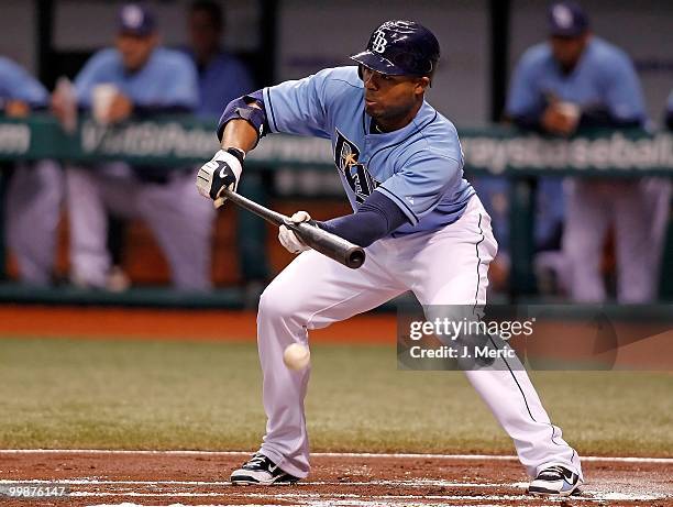 Outfielder Carl Crawford of the Tampa Bay Rays bunts against the Seattle Mariners during the game at Tropicana Field on May 16, 2010 in St....