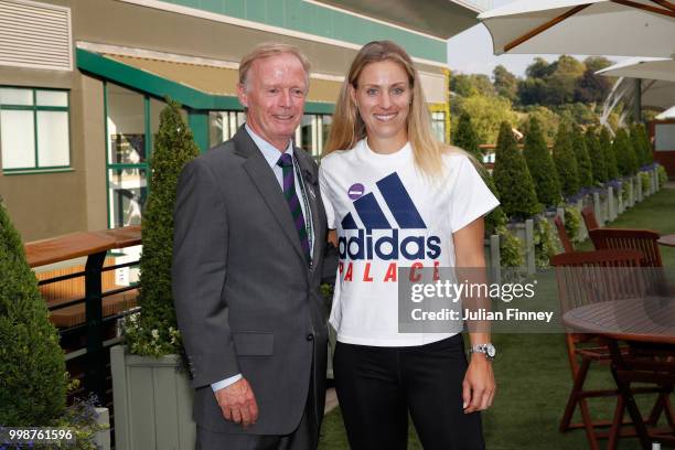 Angelique Kerber of Germany and Richard Stoakes pose after her victory over Serena Williams of The United States after the Ladies' Singles final on...