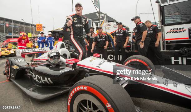 Josef Newgarden exits his car after grabbing the poll position at qualifying. Qualifying session for Honda Indy cars for poll positions for Sunday's...