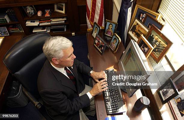 Mike Pence, R-IN., works on his computer in his office in the Longworth House Office Building.