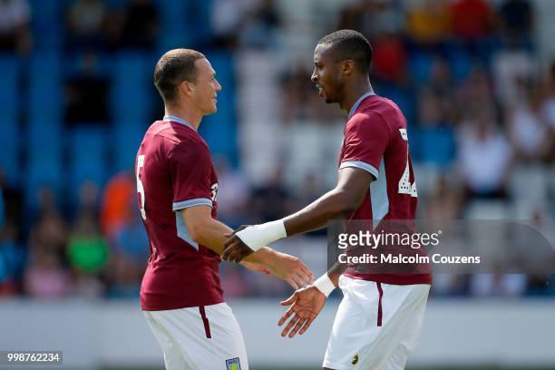 Jonathan Kodjia of Aston Villa celebrates with James Chester following the first goal of the game during the Pre-season friendly between AFC Telford...