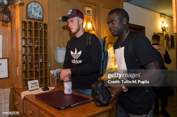 Corentin Fiore and Carlos Embalo arrive at US Citta' di Palermo training camp on July 14, 2018 in Belluno, Italy.