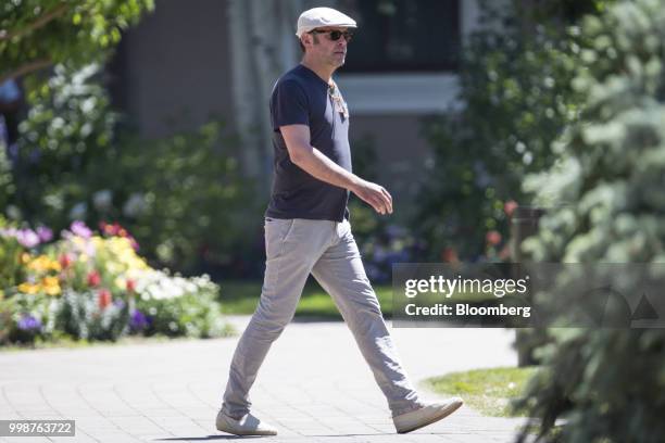 James Murdoch, chief executive officer of Twenty-First Century Fox Inc., walks the grounds after the morning session at the Allen & Co. Media and...