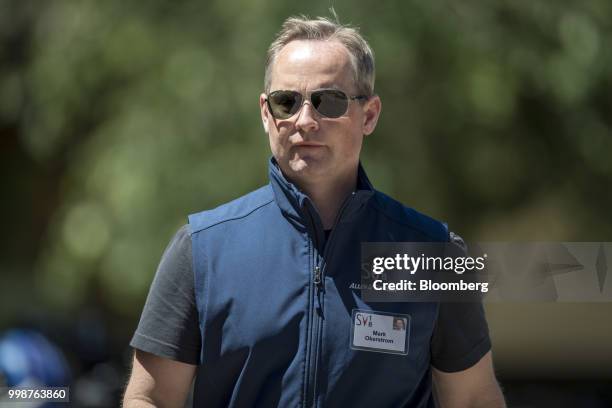 Mark Okerstrom, president, chief executive officer of Expedia Group Inc., walks the grounds after the morning session at the Allen & Co. Media and...