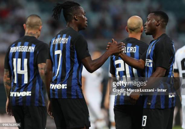Yann Karamoh of FC Internazionale celebrates his goal with his team-mate Kwadwo Asamoah during the pre-season friendly match between Lugano and FC...