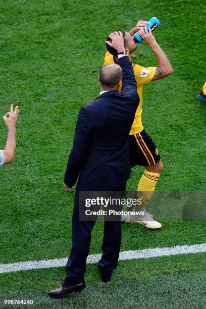 Roberto Martinez, manager of the Belgium national football team puts his hand on the head of Eden Hazard midfielder of Belgium during the FIFA 2018...