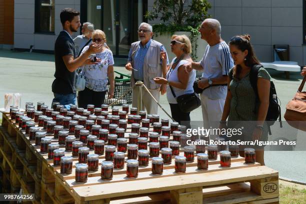 People testing visciole confitures at the Jam Festival at FICO Agri-Food Park on July 14, 2018 in Bologna, Italy.