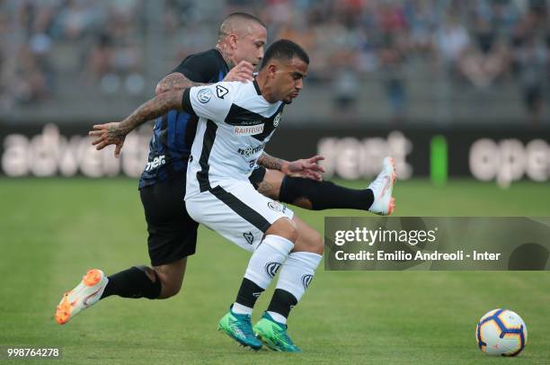 Carlos Junior of FC Lugano is challenged by Radja Nainggolan of FC Internazionale during the pre-season friendly match between Lugano and FC...