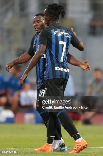 Yann Karamoh of FC Internazionale celebrates his goal with his teammate Kwadwo Asamoah during the pre-season friendly match between Lugano and FC...