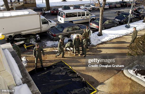 The Marine haz-mat team from Dover Delaware along with the Coast Guard and the U.S. Capitol Police prepare to enter the Russell Senate Office...