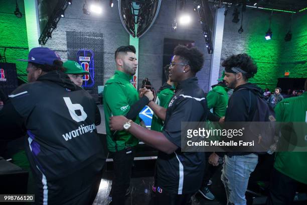 Mel East of Celtics Crossover Gaming greets Timelycook of Kings Guard Gaming during Day 3 of the NBA 2K - The Ticket tournament on July 14, 2018 at...