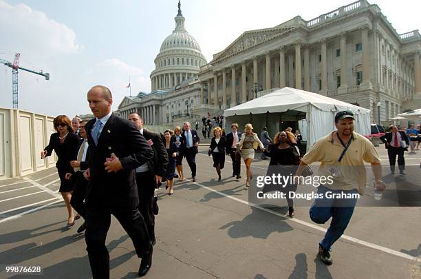 Visitors and staff evacuate the Capitol on Wednesday afternoon. The warning lasted only a few minutes before the Capitol Police announced it was a...