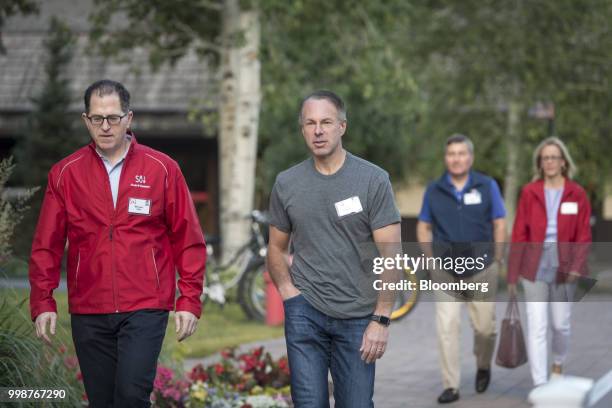 Michael Dell, chairman and chief executive officer of Dell Inc., left, and Devin Wenig, president and chief executive officer of eBay Inc., arrive...