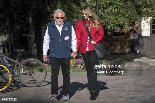 Robert Kraft, chief executive officer and founder of Kraft Group, left, and Ricki Lander arrive for the morning session at the Allen & Co. Media and...