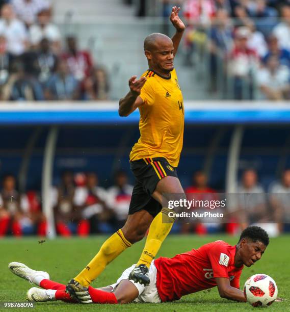 Vincent Kompany of the Belgium national football team and Marcus Rashford of the England national football team vie for the ball during the 2018 FIFA...