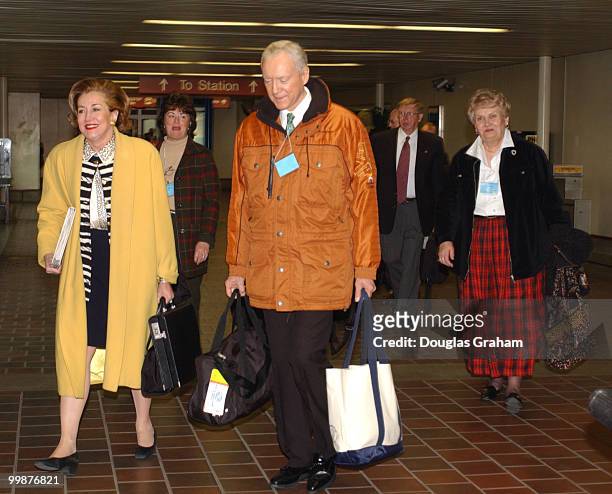 Elizabeth Dole, R-N.C. And Orrin G. Hatch, R-UT., along with other House and Senate Republicans walk to a train in Union Station for their retreat at...