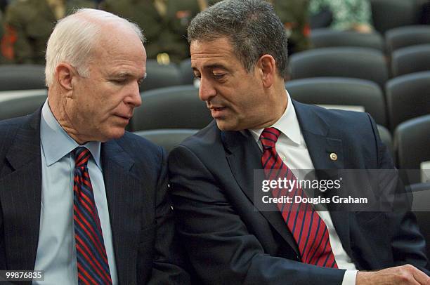 John McCain, R-AZ., and Russ Feingold, D-WI., talk before the start of the Congressional Remembrance Ceremony on Thursday, March 13, 2008 to honor...