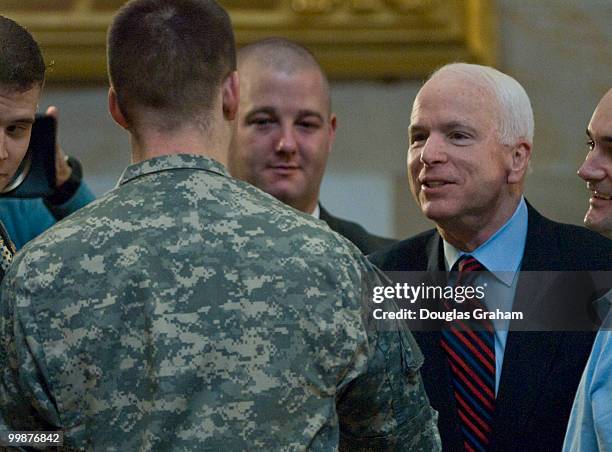 John McCain, R-AZ., greets some of the troops attending the Congressional Remembrance Ceremony Thursday, March 13, 2008 to honor the five years of...