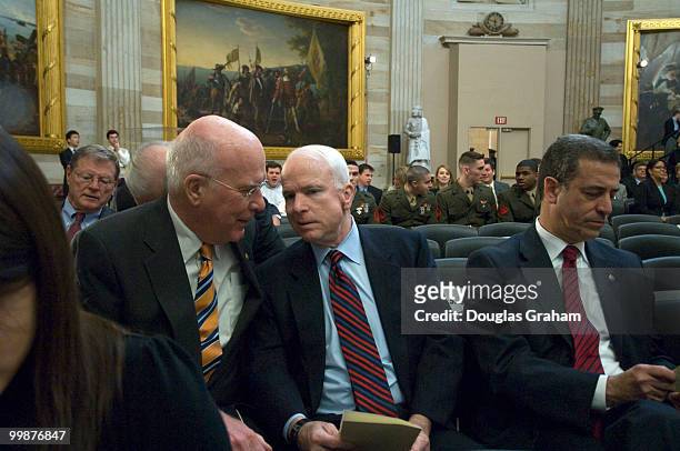 Patrick Leahy, D-VT., John McCain, R-AZ., and Russ Feingold, D-WI., talk during the Congressional Remembrance Ceremony Thursday, March 13, 2008 to...