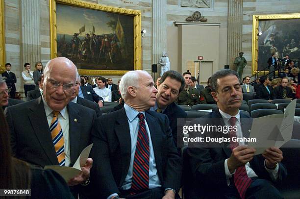 Patrick Leahy, D-VT., John McCain, R-AZ., Sam Brownback, R-KS., and Russ Feingold, D-WI., talk during the Congressional Remembrance Ceremony...