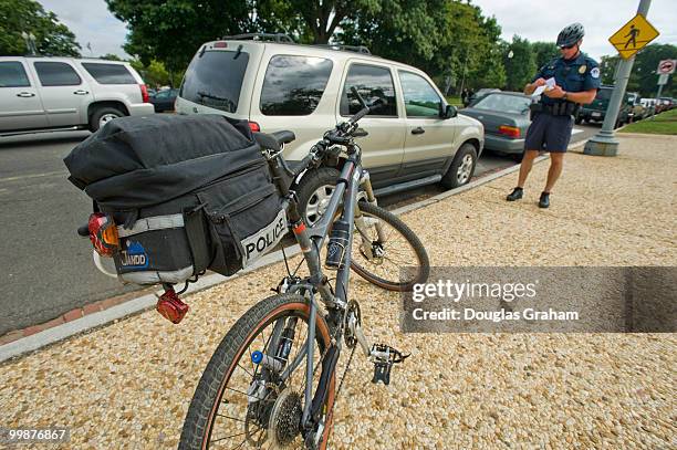 United States Capitol Hill Policemen writes a parking ticket near the Russell Senate Office Building in Washington, D.C., September 23, 2009.