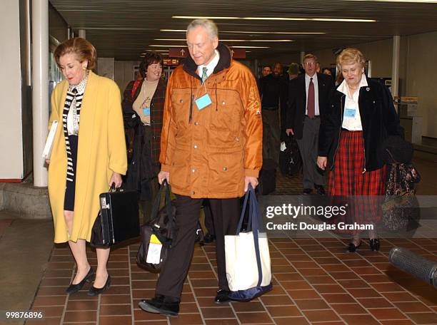 Elizabeth Dole, R-N.C. And Orrin G. Hatch, R-UT., along with other House and Senate Republicans walk to a train in Union Station for their retreat at...