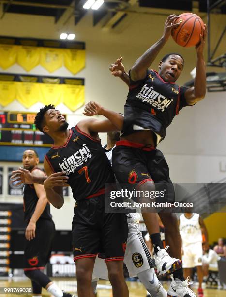 Will Davis II looks on as Marqueze Coleman of the Kimchi Express grabs a rebound in front of Calvin Williams of Team Colorado in The Basketball...