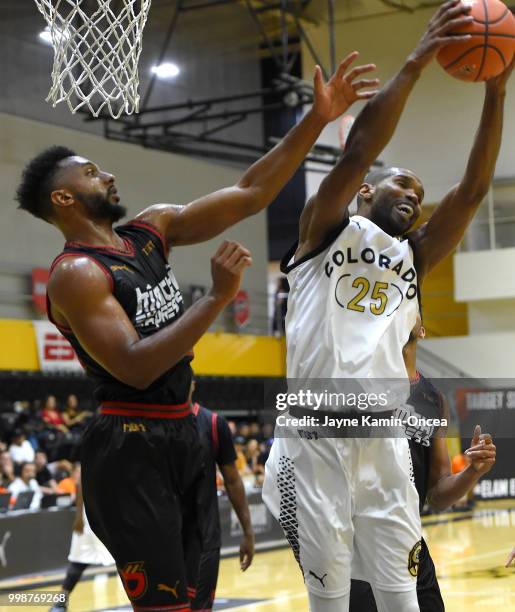 Bryon Wesley of the Kimchi Express and Jeremy Williams of Team Colorado go for a rebound in The Basketball Tournament Western Regional game at...