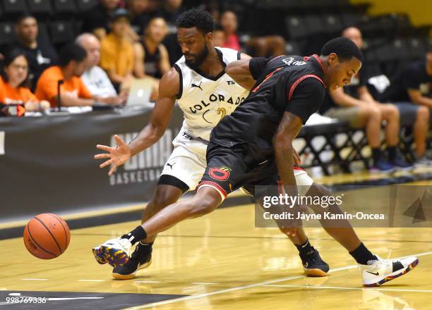 Marvin Williams#2 of Team Colorado steals the ball from Kyle Austin of the Kimchi Express in The Basketball Tournament Western Regional game at...