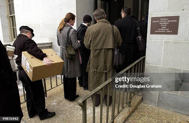 Staffers and public prepare to enter the Russell Senate Office Building after the building was declared safe after the ricin scare.