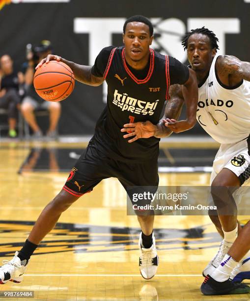 Marcus Hall of Team Colorado chases down Marqueze Coleman of the Kimchi Express as he takes the ball down court in The Basketball Tournament Western...
