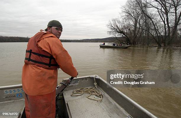 Chris Fenderson, of Living Lands & Water shows the media some of the areas that will be targets for the cleanup of the Potomac and Anacostia Rivers....