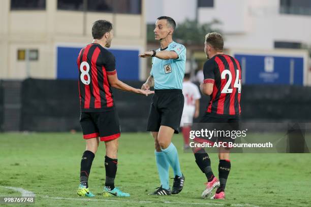 Harry Arter and Ryan Fraser complain to referee after Jermain Defoe is pulled back during the pre-season friendly between AFC Bournemouth and Sevilla...