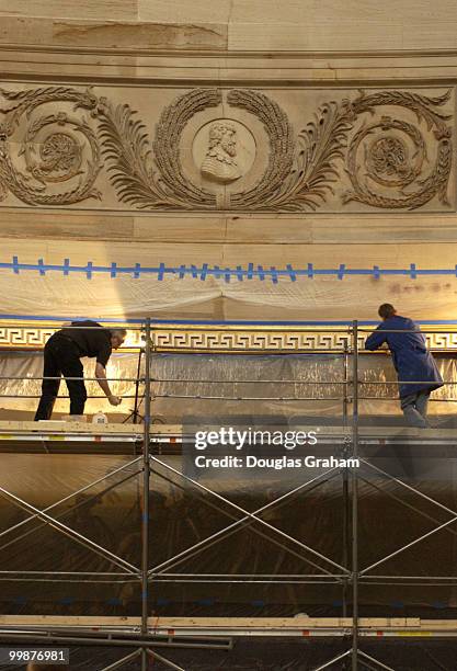 The gilded frames around the eight monumental paintings in the Capitol Rotunda are being cleaned and repaired one at a time by fine art conservators....
