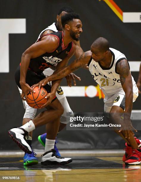 Dominique Coleman of Team Colorado steals the ball from Bryon Wesley of the Kimchi Express in The Basketball Tournament Western Regional game at...