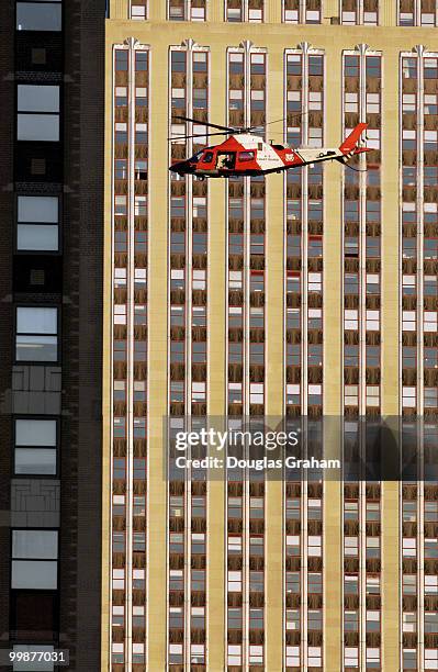 Coast Guard helicopter, complete with 60 caliber machine gun patrols the sky above Madison Square Garden during Republican National Convention in new...
