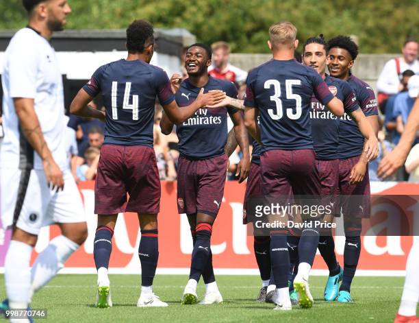 Pierre-Emerick Aubameyang celebrates scoing a goal for Arsenal with Ainsley Maitland-Niles during the match between Borehamwood and Arsenal at Meadow...