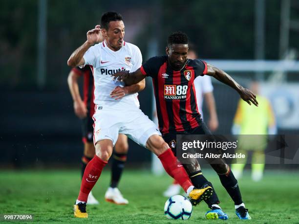 Borja San Emeterio of Sevilla FC duels for the ball with Jermain Defoe of AFC Bournemouth during the Pre- Season friendly match between Sevilla FC...