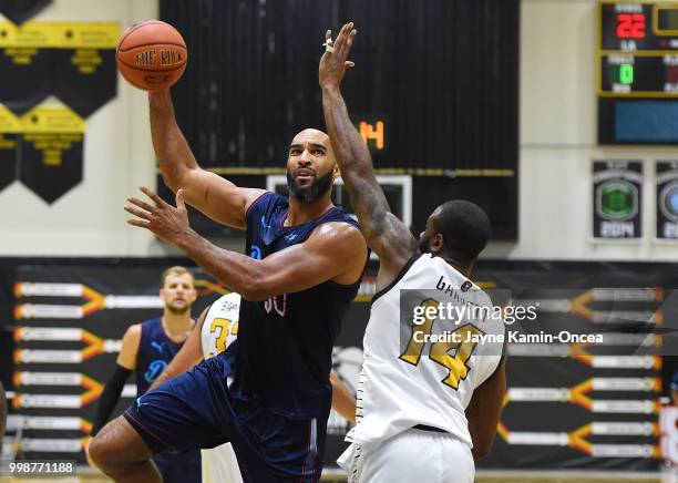 Justin Edwards of the Broad St. Brawlers defends a shot by Liam McMorrow of Eberlein Drive in The Basketball Tournament Western Regional game at...