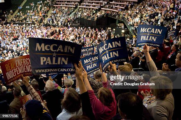 Convention goers hold up signs as Republican Vice Presidential Presumptive Nominee Sarah Palin speaks on the third day of the Republican National...