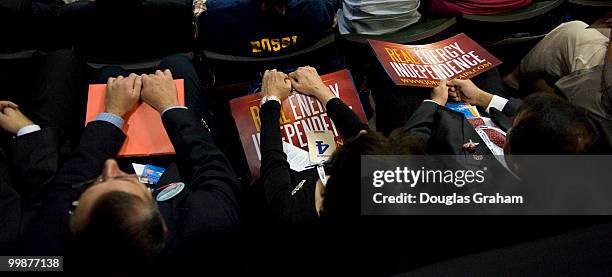 Conventioneers hold onto signs as Republican Vice Presidential Presumptive Nominee Sarah Palin speaks on the third day of the Republican National...