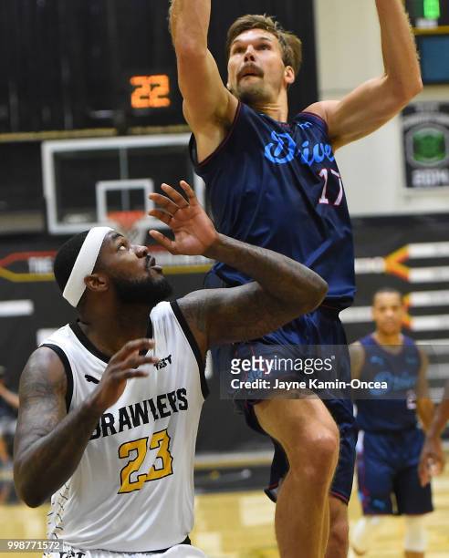 Steve Taylor Jr. #23 of the Broad St. Brawlers defends a shot by Lou Amundson of Eberlein Drive in The Basketball Tournament Western Regional game at...
