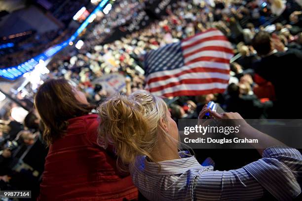 Conventioneers video tape, wave flags and enjoy the forth day of the Republican National Convention held at the Xcel Center in St. Paul, September 4,...