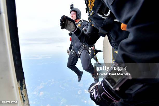 The U.S. Army Parachute Team The Golden Knights prepare for their demonstration jump at 10,500 feet at the 2018 Great New England Air and Space Show...