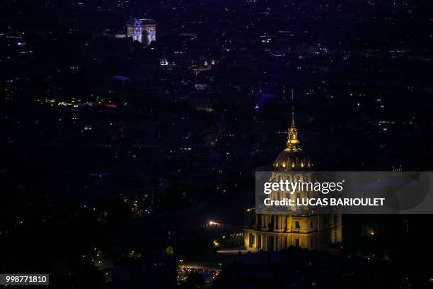 This picture taken on July 14, 2018 from the panoramic observatory of the Montparnasse Tower shows the Eglise des Invalides church and the Arc de...