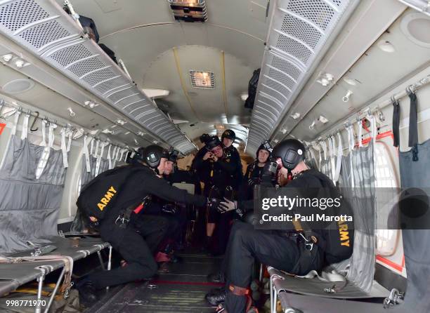 The U.S. Army Parachute Team The Golden Knights prepare for their demonstration jump at 10,500 feet at the 2018 Great New England Air and Space Show...